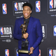 NBA player Giannis Antetokounmpo, of the Milwaukee Bucks, poses in the press room with most valuable player award at the NBA Awards on Monday, June 24, 2019, at the Barker Hangar in Santa Monica, Calif.